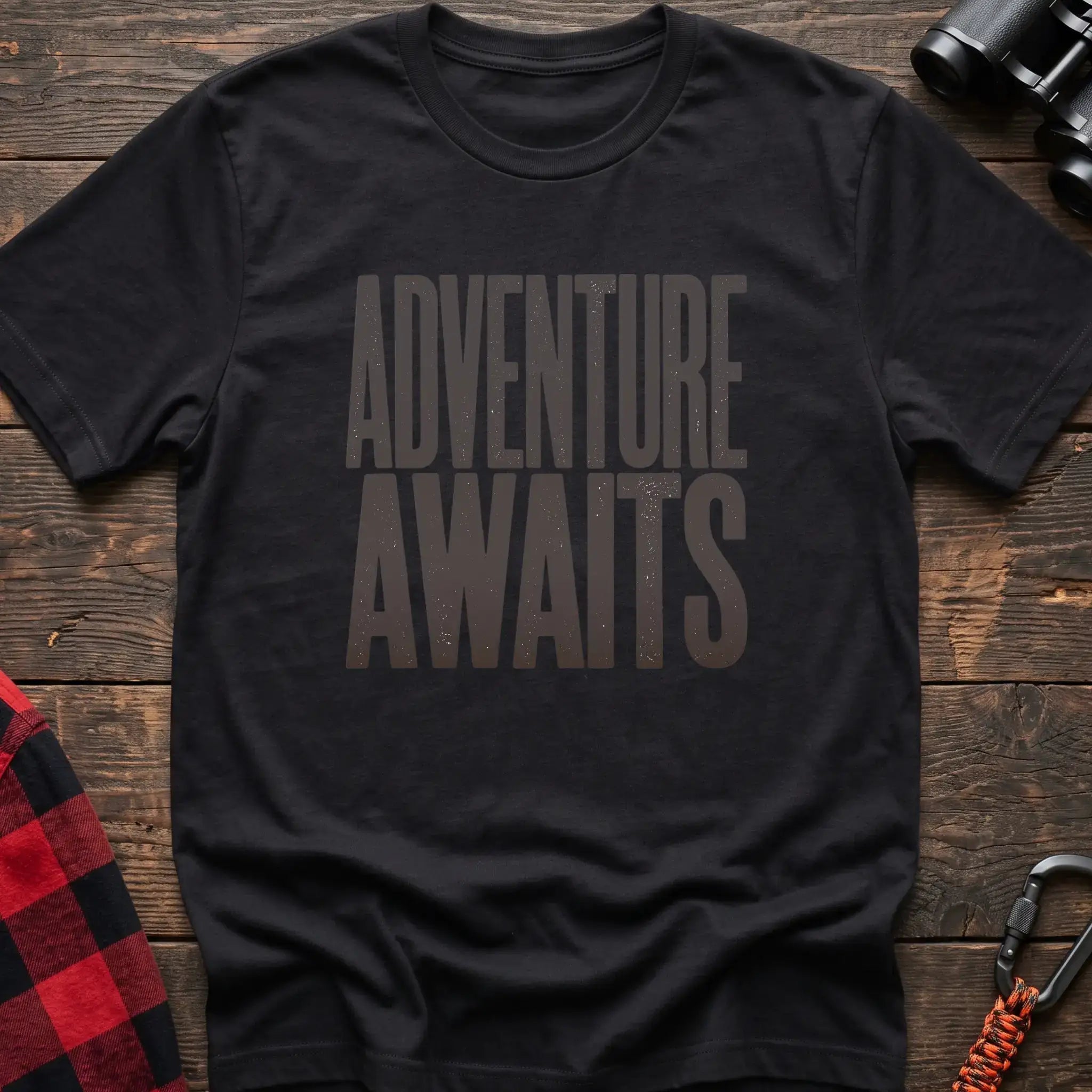 Black t-shirt with large distressed gray text reading Adventure Awaits