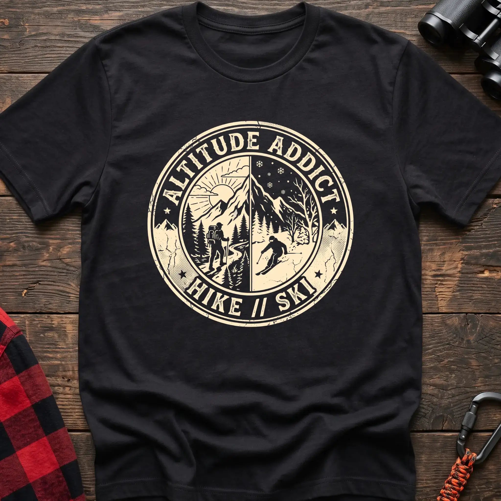 Black t-shirt with circular badge graphic of a hiker and skier on split mountain scenes, reading Altitude Addict Hike Ski