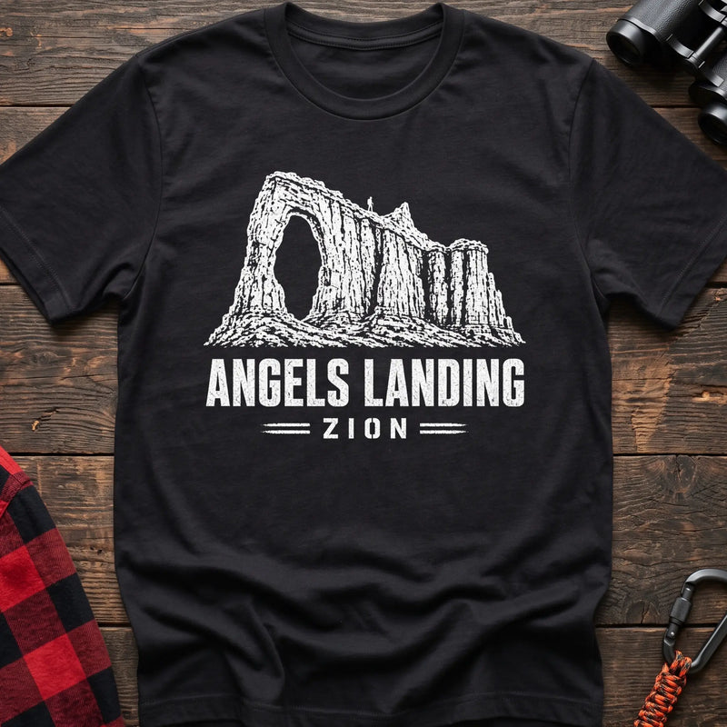 Black cotton t-shirt with a canyon graphic and Angels Landing Zion text on rustic wood