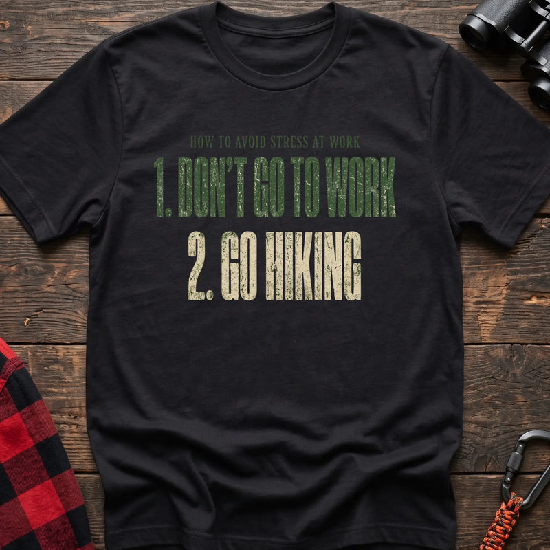 Black cotton t-shirt with How to Avoid Stress at Work Don’t Go to Work Go Hiking text on rustic woo