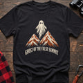 Black cotton t-shirt with a ghost over mountains graphic and Ghost of the False Summit text on rustic wood