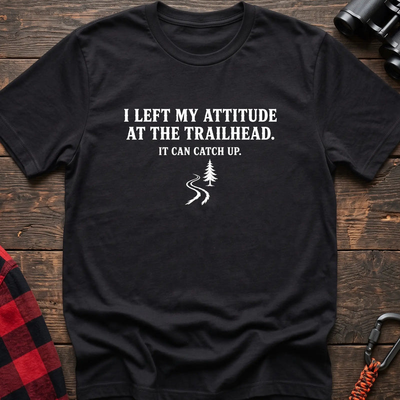 Black cotton t-shirt with a trail graphic and I Left My Attitude at the Trailhead It Can Catch Up text on rustic wood