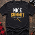 Black cotton t-shirt with a mountain graphic and Nice Summit Now Do It Backwards text on rustic wood