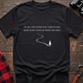 Black cotton hiking t-shirt with white quote "Of all the paths you take in life make sure a few of them are dirt" and winding dirt path to pine tree graphic