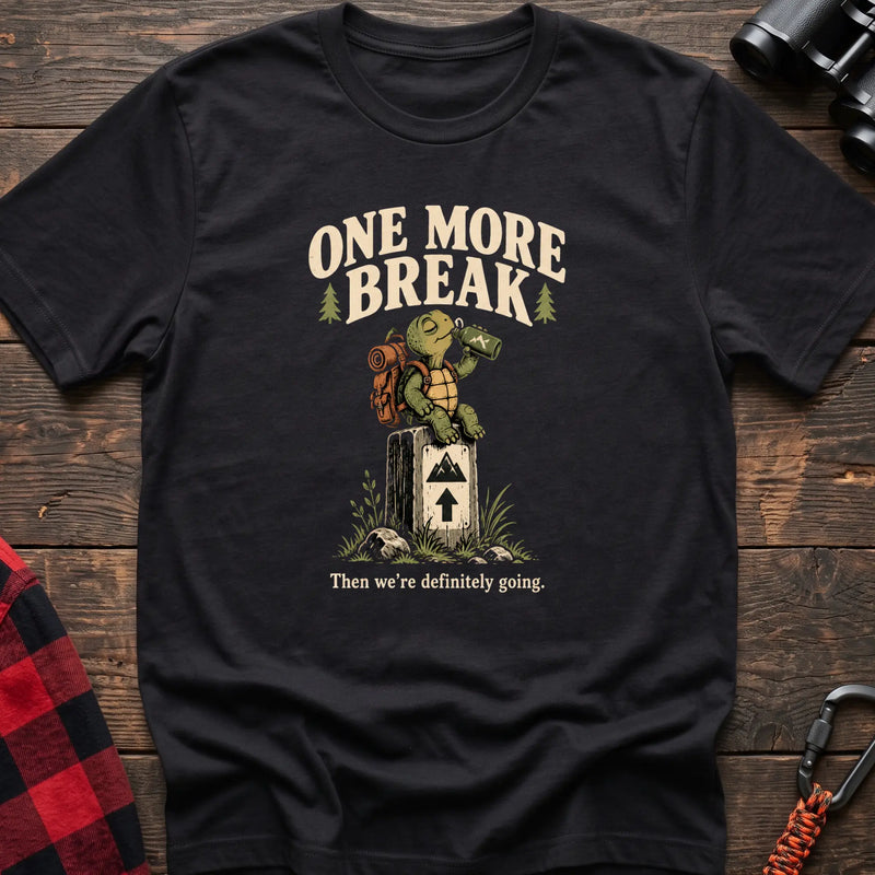 Black cotton t-shirt with a hiking turtle graphic and One More Break text on rustic wood