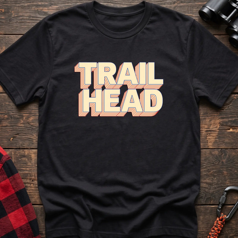 Black cotton t-shirt with retro stacked Trail Head text on rustic wood