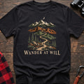 Black cotton t-shirt with a mountain trail graphic and Wander at Will text on rustic wood
