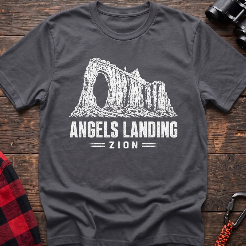Charcoal cotton t-shirt with a canyon graphic and Angels Landing Zion text on rustic wood
