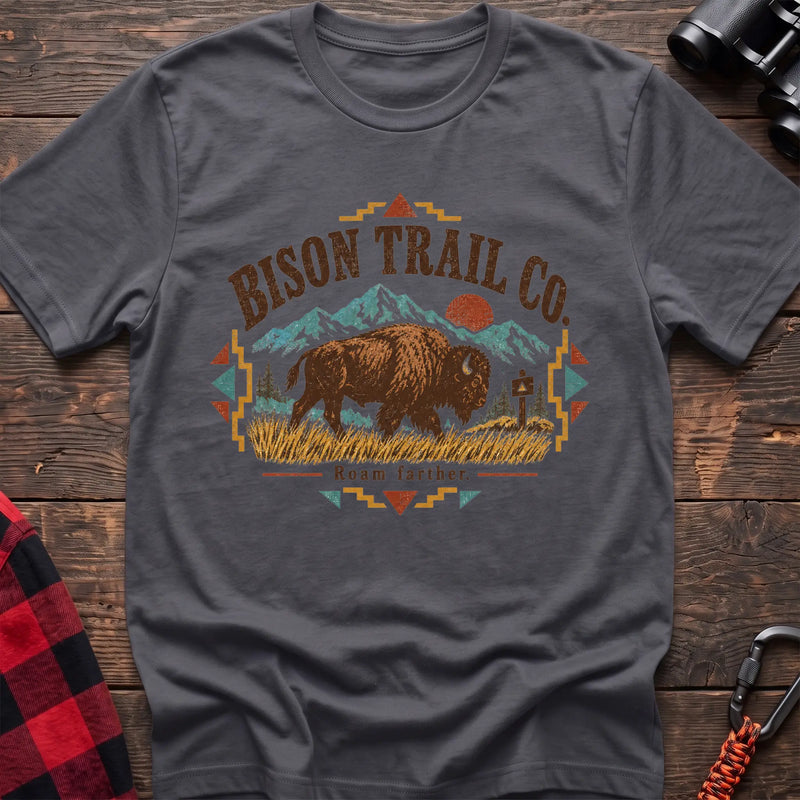 Charcoal cotton t-shirt with a bison and mountain graphic and Bison Trail Co text on rustic wood