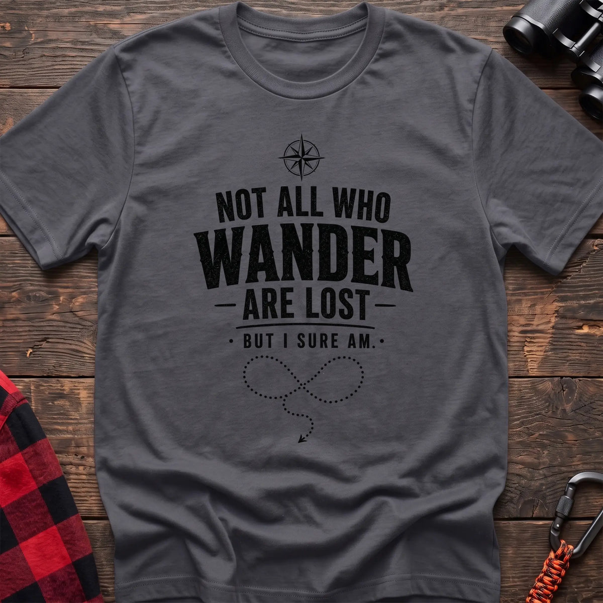 Charcoal cotton hiking t-shirt with compass, "Not all who wander are lost but I sure am" quote, and dotted wandering path graphic