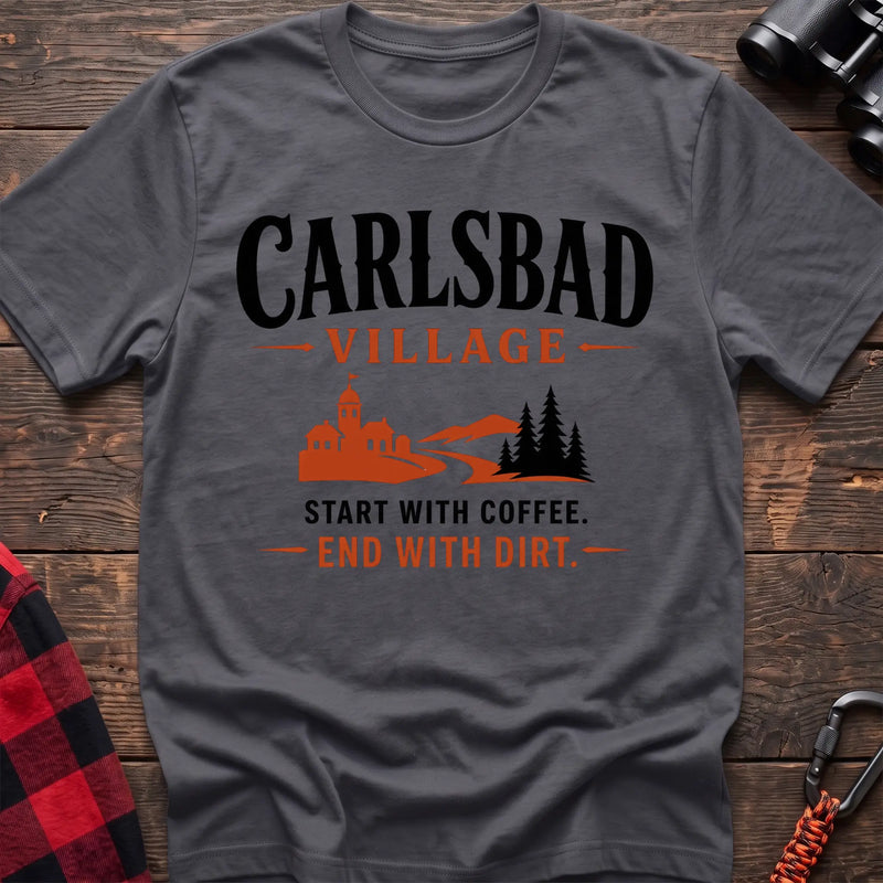 Charcoal cotton t-shirt with a village and trail graphic and Carlsbad Village Start with Coffee End with Dirt text on rustic wood
