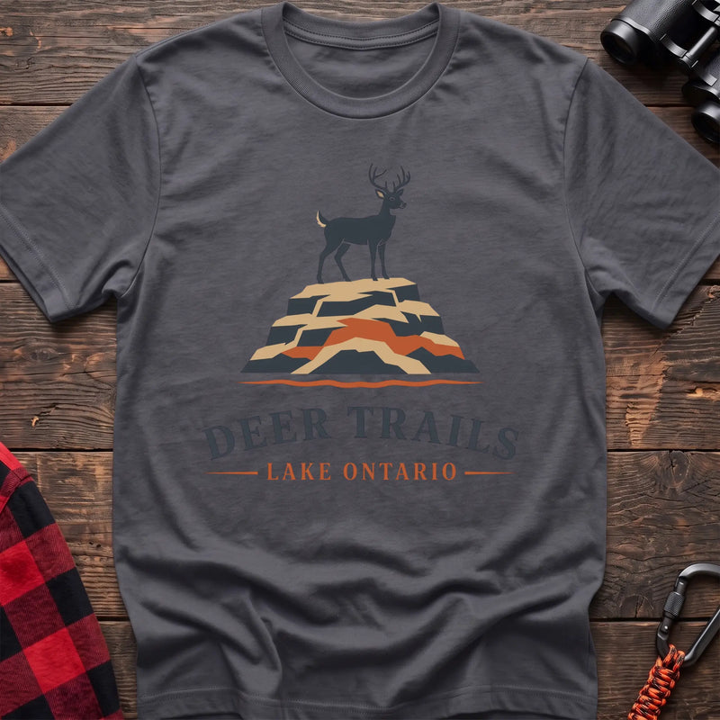Charcoal hiking t-shirt with a deer on a rocky bluff and the text “Deer Trails Lake Ontario”