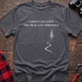 Charcoal cotton t-shirt with a winding trail graphic and I Didn’t Get Lost The Trail Got Ambitious text on rustic wood