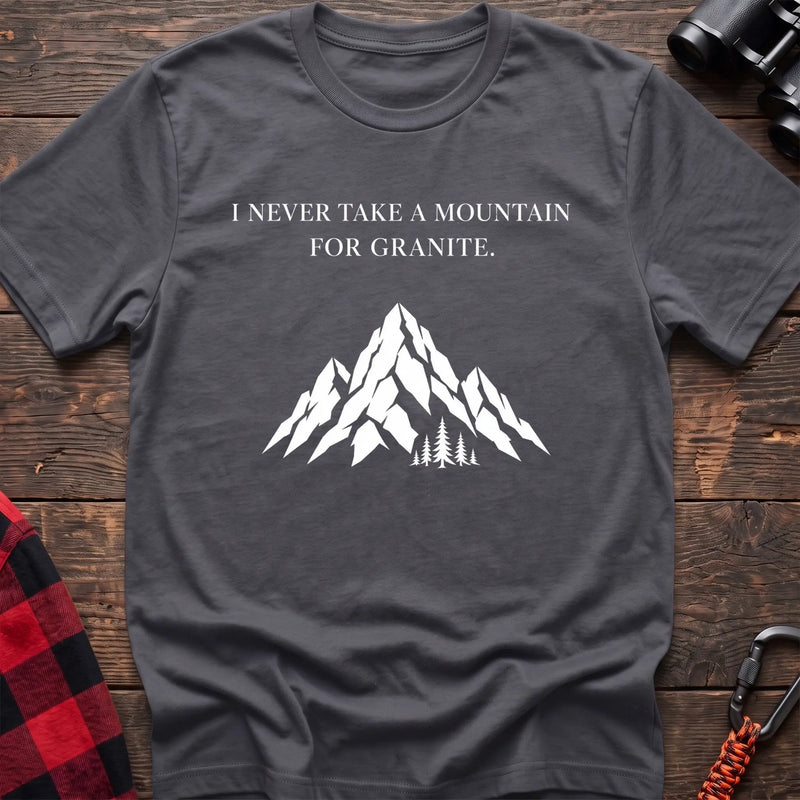 Charcoal cotton t-shirt with a mountain graphic and I Never Take a Mountain for Granite text on rustic wood