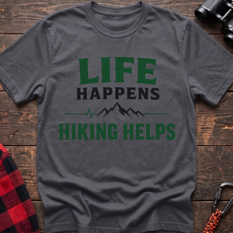 Charcoal cotton t-shirt with a mountain heartbeat graphic and Life Happens Hiking Helps text on rustic wood