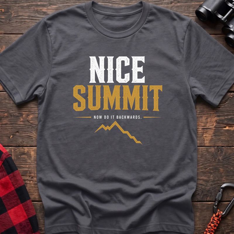 Charcoal cotton t-shirt with a mountain graphic and Nice Summit Now Do It Backwards text on rustic wood