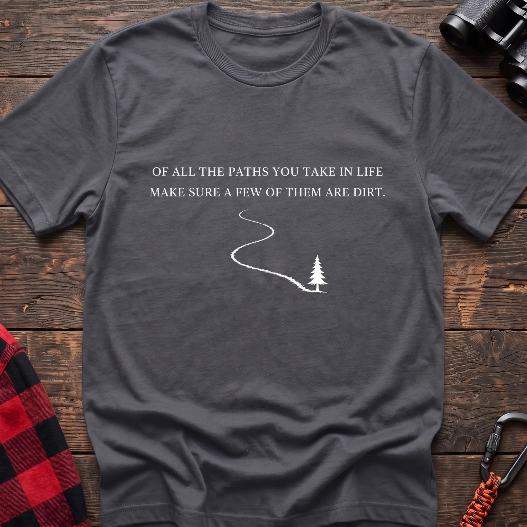 Charcoal cotton hiking t-shirt with white quote "Of all the paths you take in life make sure a few of them are dirt" and winding dirt path to pine tree graphic