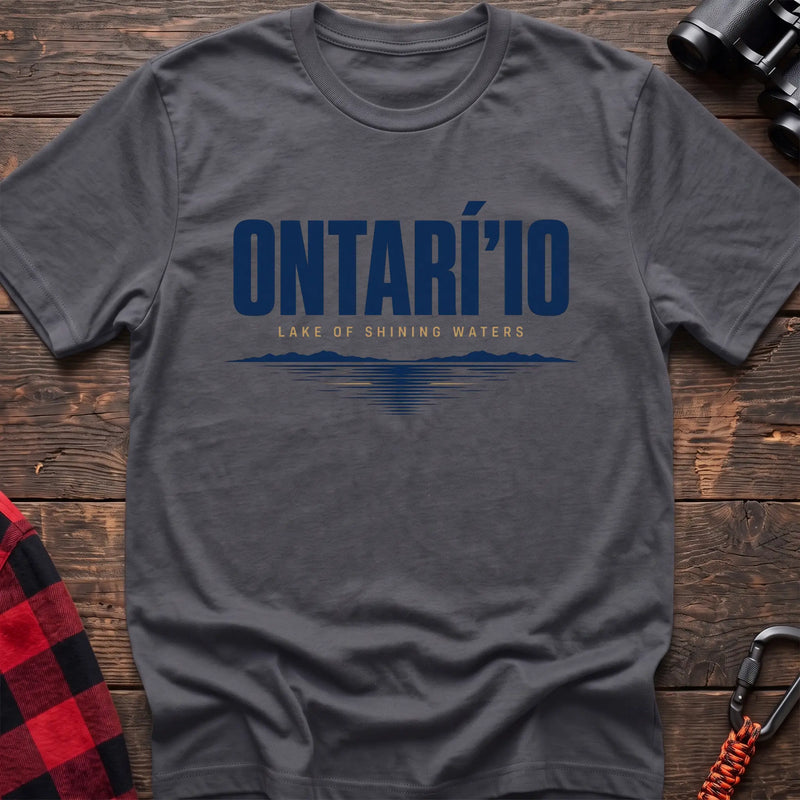 Charcoal cotton hiking t-shirt with Ontarí'io Lake of Shining Waters text and stylized lake reflection graphic