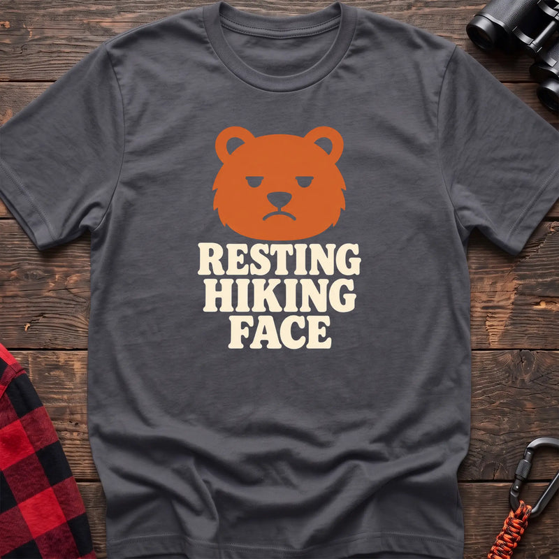 Charcoal cotton t-shirt with a grumpy bear graphic and Resting Hiking Face text on rustic wood