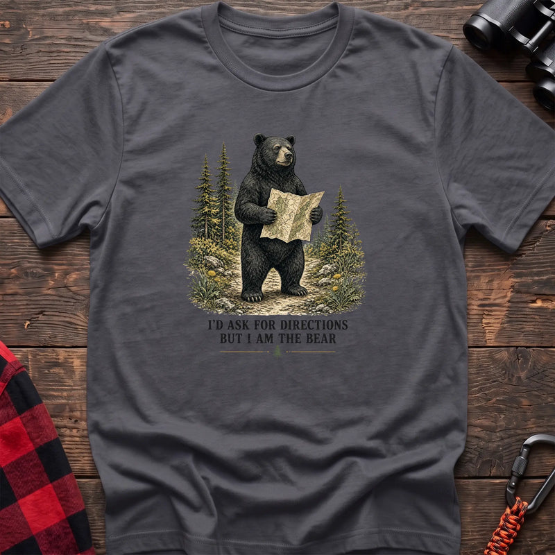 Charcoal cotton t-shirt with a bear holding a map graphic and I’d Ask for Directions But I Am the Bear text on rustic wood