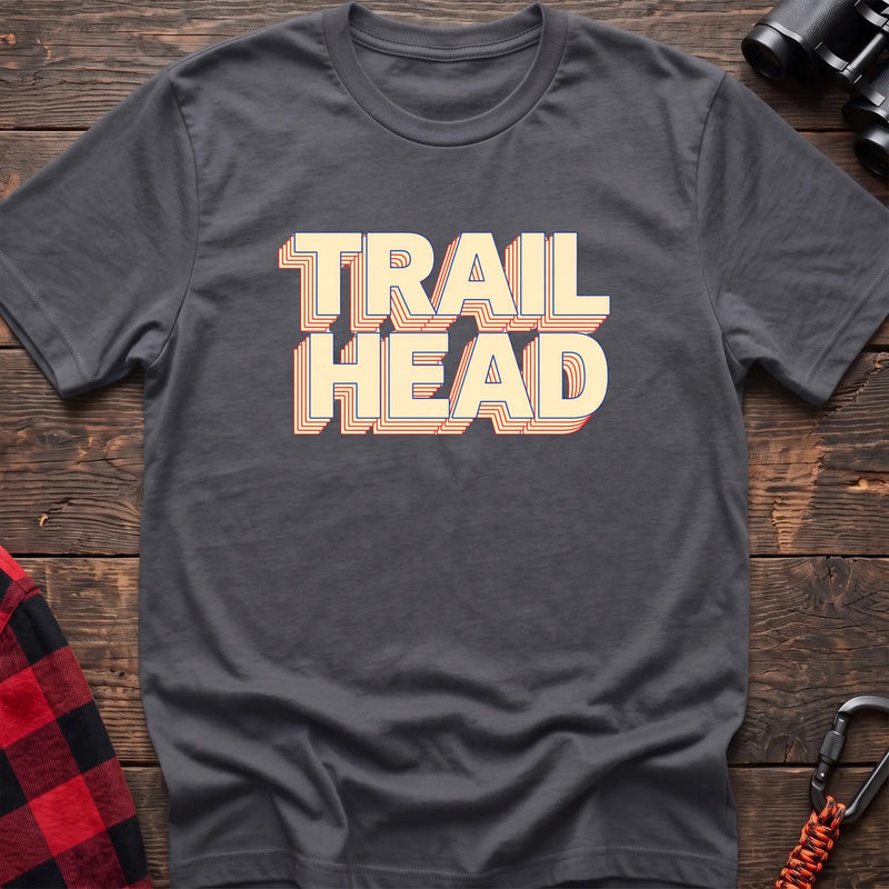 Black cotton t-shirt with retro stacked Trail Head text on rustic wood