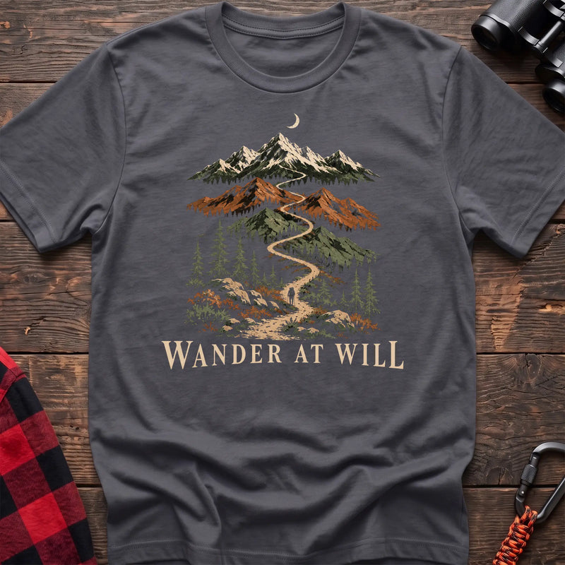 Charcoal cotton t-shirt with a mountain trail graphic and Wander at Will text on rustic wood