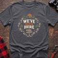 Charcoal cotton t-shirt with a bootprint circle and trail sign graphic and We’ve Been Here text on rustic wood