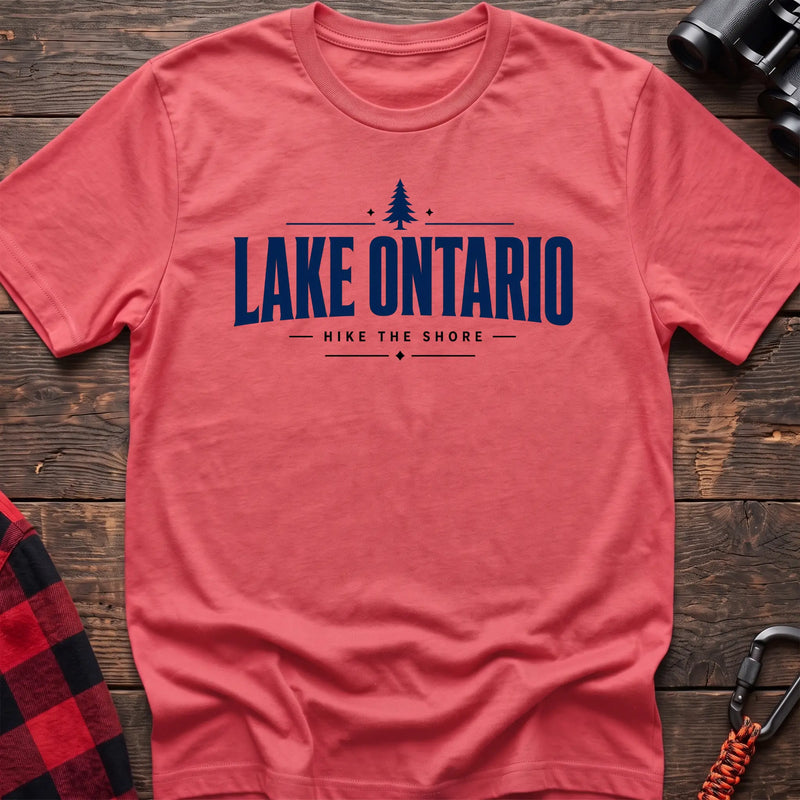 Coral silk cotton hiking t-shirt with pine tree icon and "Lake Ontario hike the shore" text
