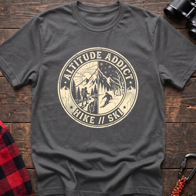 Graphite heather t-shirt with circular badge graphic of a hiker and skier on split mountain scenes, reading Altitude Addict Hike Ski
