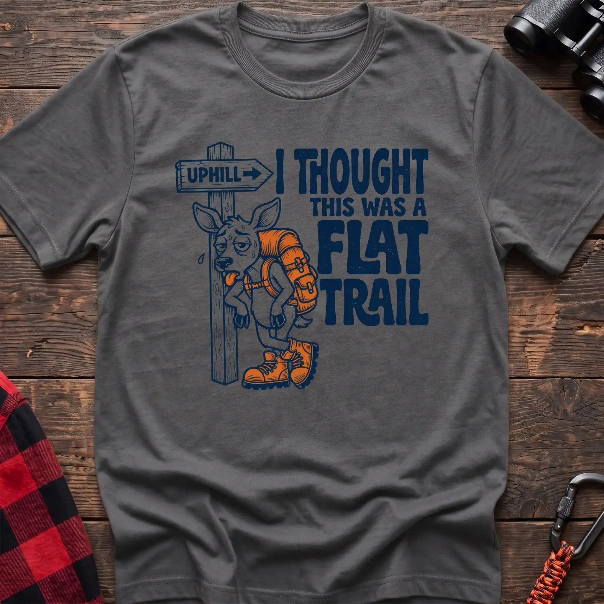 Graphite heather t-shirt with exhausted deer leaning on an Uphill trail sign and the text I Thought This Was a Flat Trail