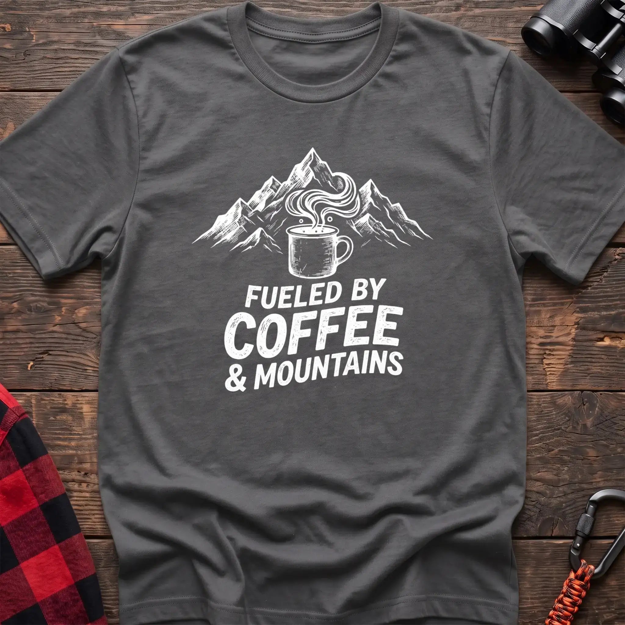 Graphite heather t-shirt with white graphic of a steaming coffee mug in front of mountains and the text Fueled by Coffee & Mountains
