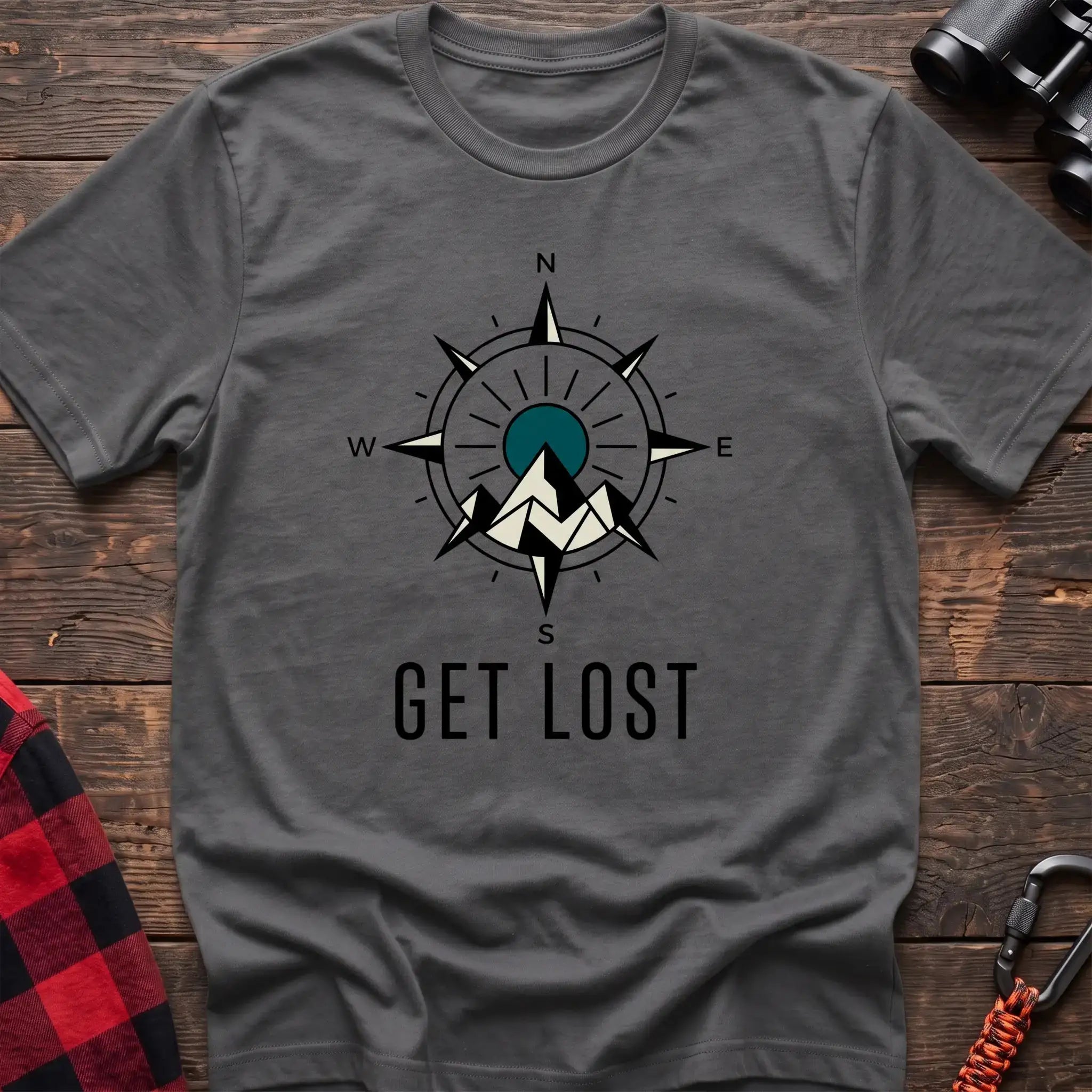Graphite heather t-shirt with compass rose graphic featuring mountains in the center and the text Get Lost