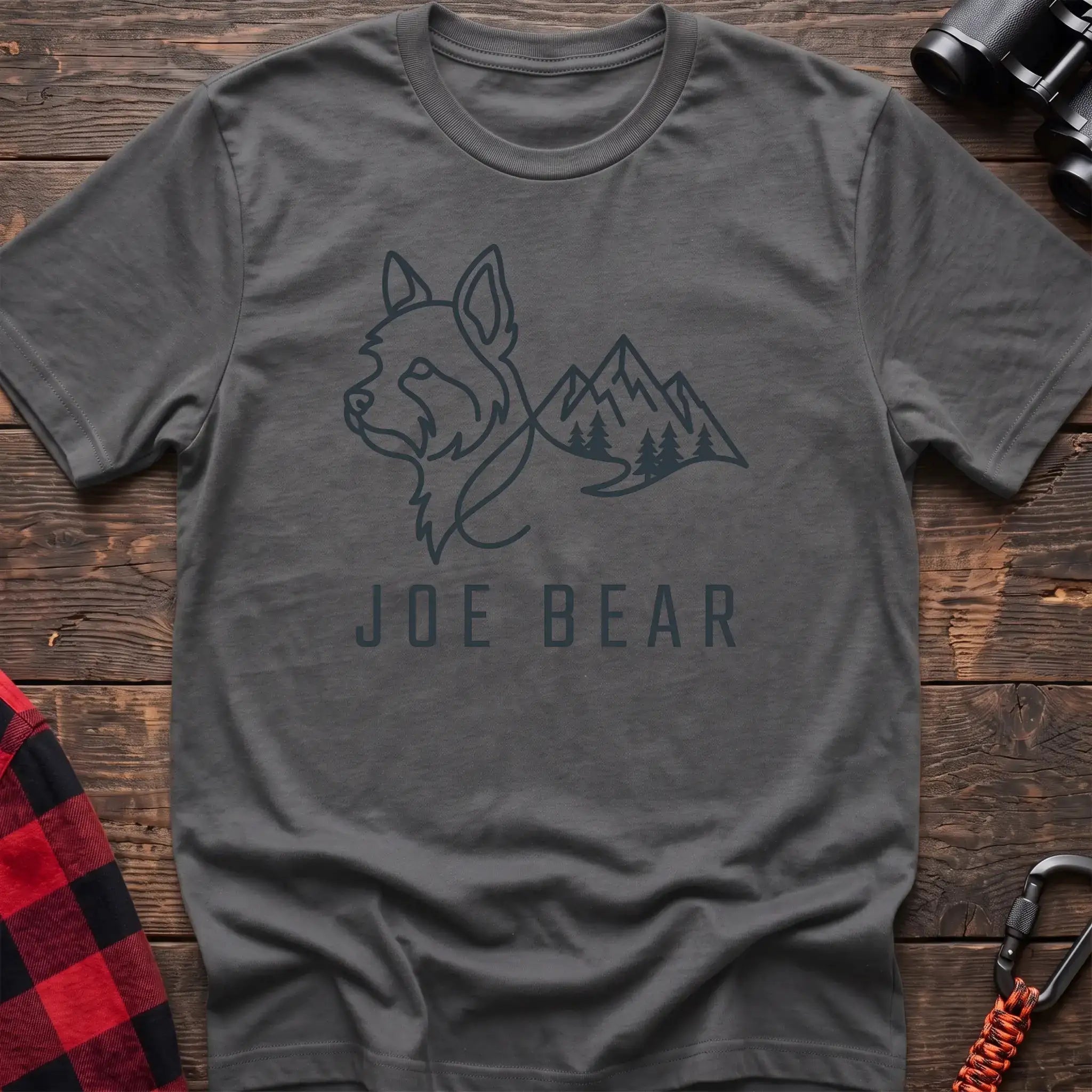 Graphite heather t-shirt with dark line art of a yorkie dog head blending into mountains and pine trees, with the text Joe Bear