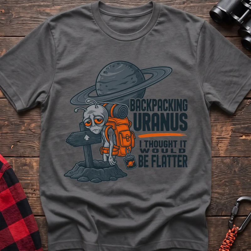Graphite heather t-shirt with tired alien backpacker next to a trail sign and the text Backpacking Uranus I Thought It Would Be Flatter