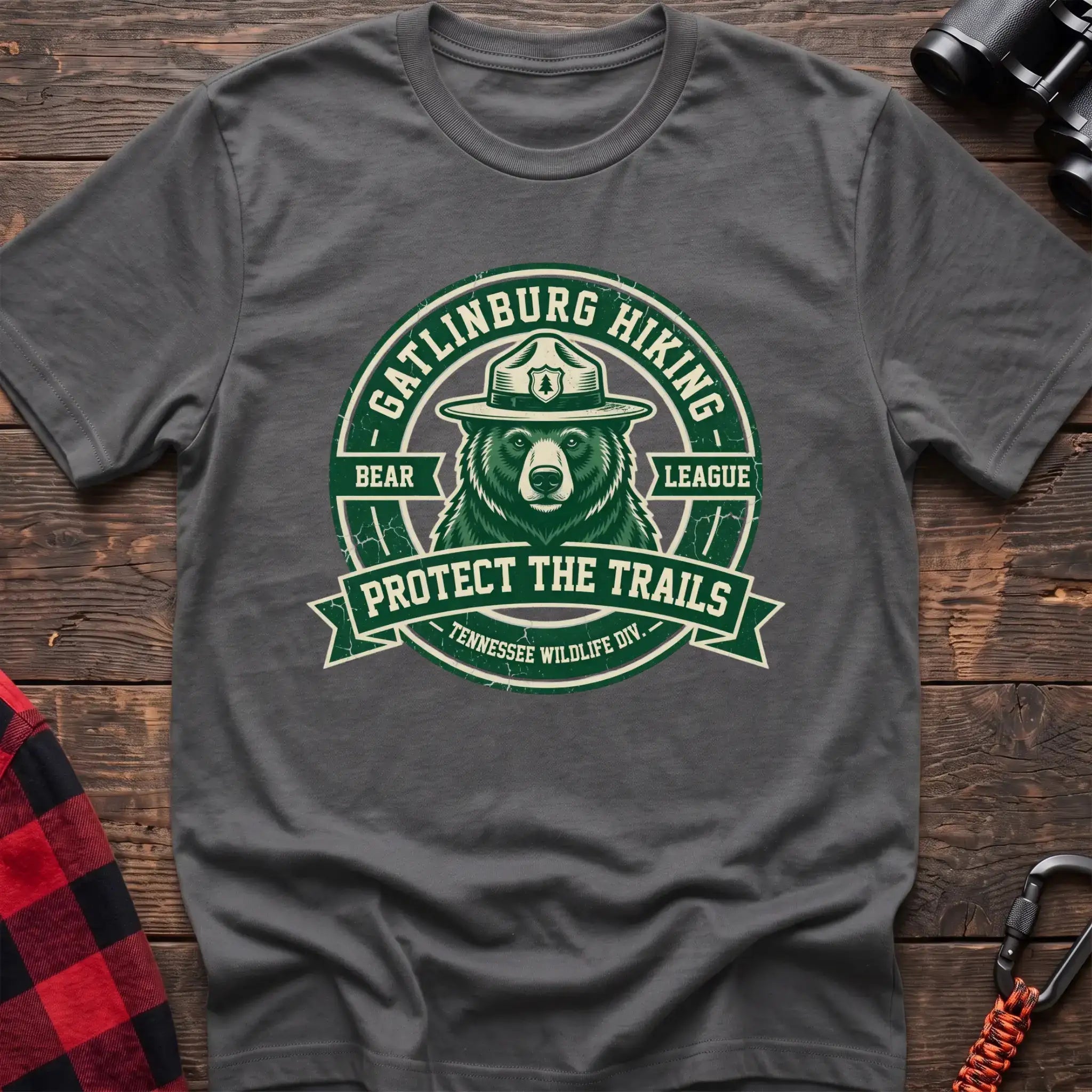 Graphite heather t-shirt with circular badge of a bear in a ranger hat reading Gatlinburg Hiking Bear League Protect the Trails