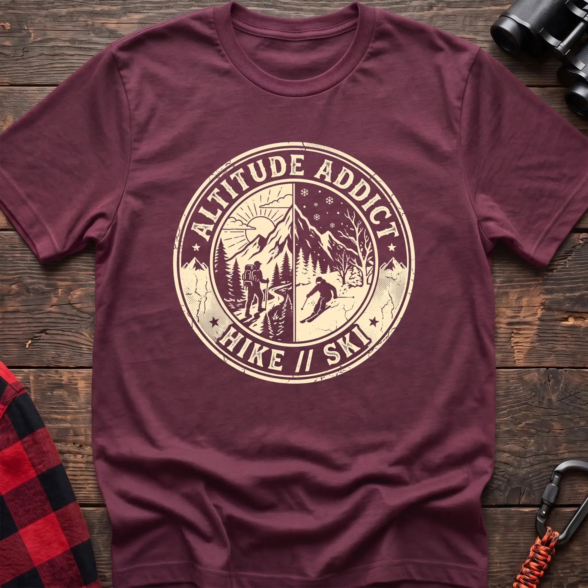 Heather maroon t-shirt with circular badge graphic of a hiker and skier on split mountain scenes, reading Altitude Addict Hike Ski