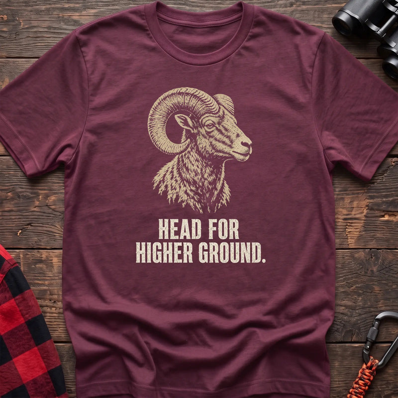 Heather maroon cotton t-shirt with a bighorn ram graphic and Head for Higher Ground text on rustic wood