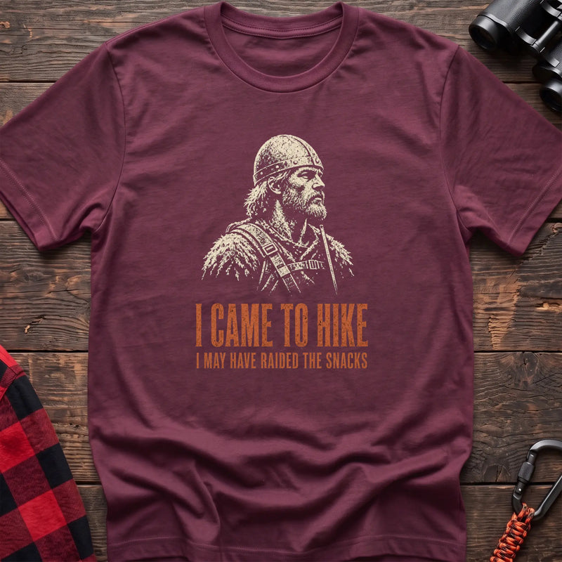 Heather maroon cotton t-shirt with a Viking graphic and I Came to Hike I May Have Raided the Snacks text on rustic wood