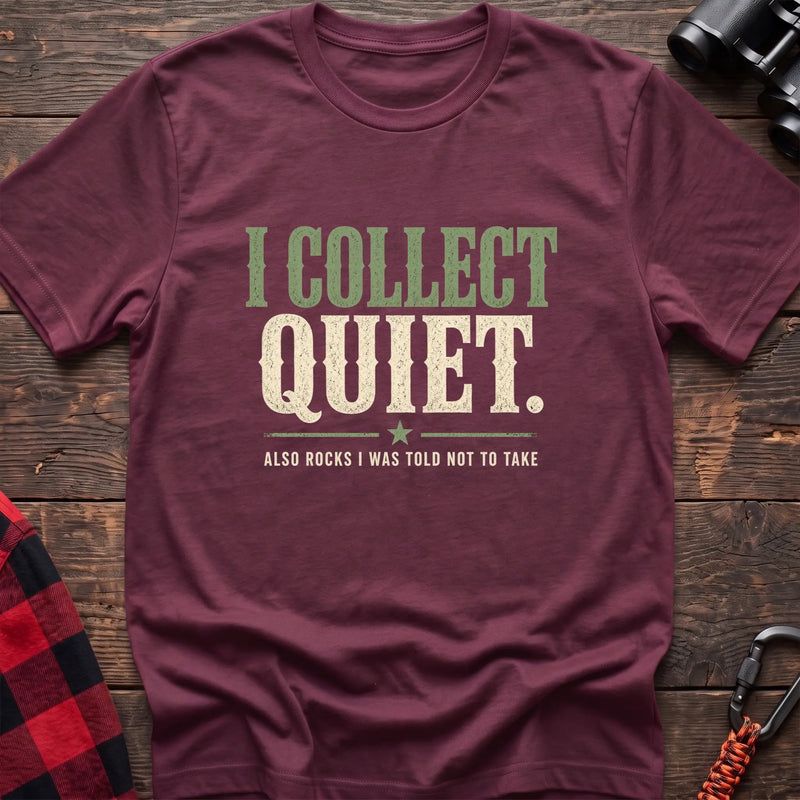 Heather maroon cotton t-shirt with I Collect Quiet Also Rocks I Was Told Not to Take text on rustic wood