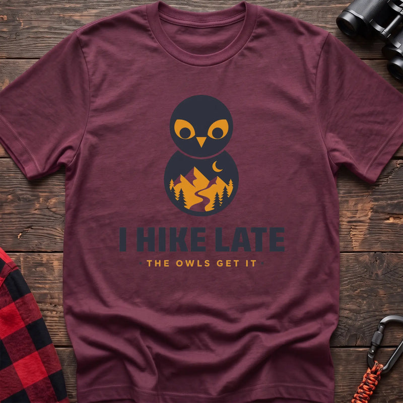 Heather maroon hiking t-shirt with stacked owl graphic and the text “I Hike Late The Owls Get It”
