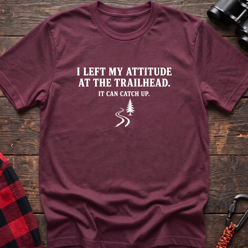Heather maroon cotton t-shirt with a trail graphic and I Left My Attitude at the Trailhead It Can Catch Up text on rustic wood
