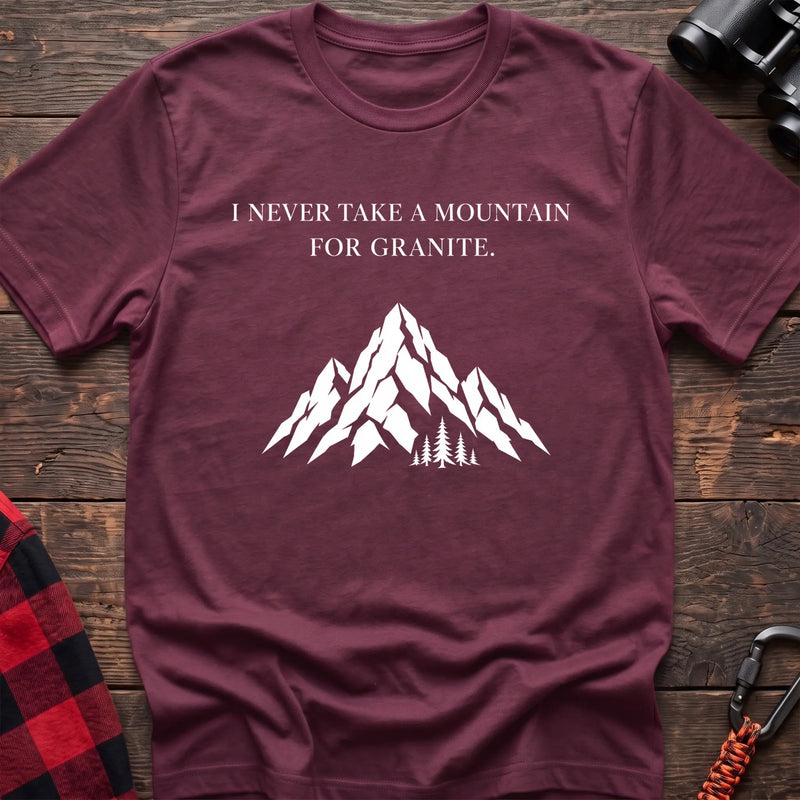 Heather maroon cotton t-shirt with a mountain graphic and I Never Take a Mountain for Granite text on rustic wood