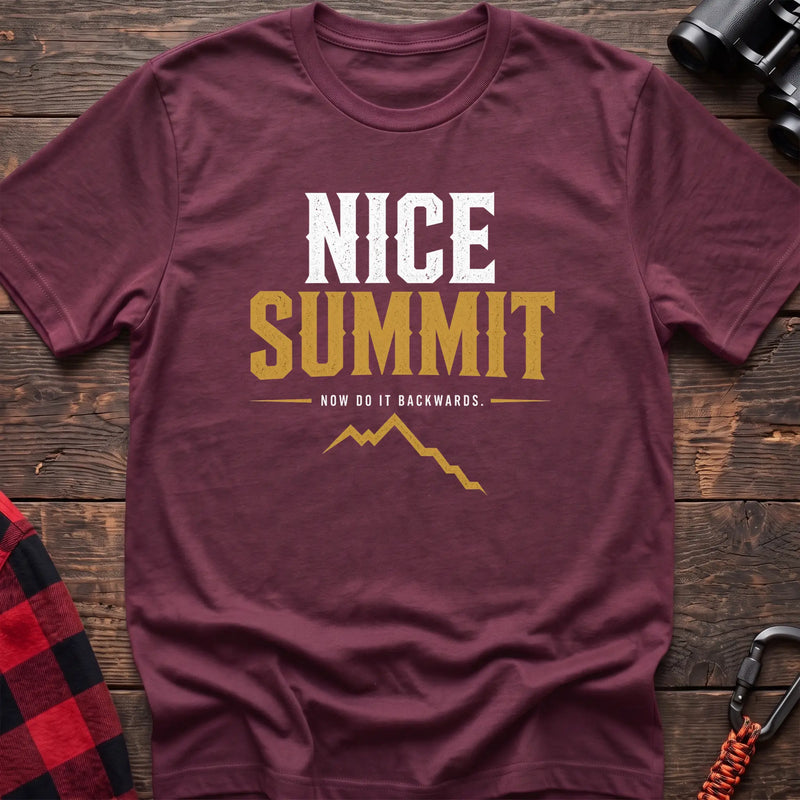 Heather maroon cotton t-shirt with a mountain graphic and Nice Summit Now Do It Backwards text on rustic wood