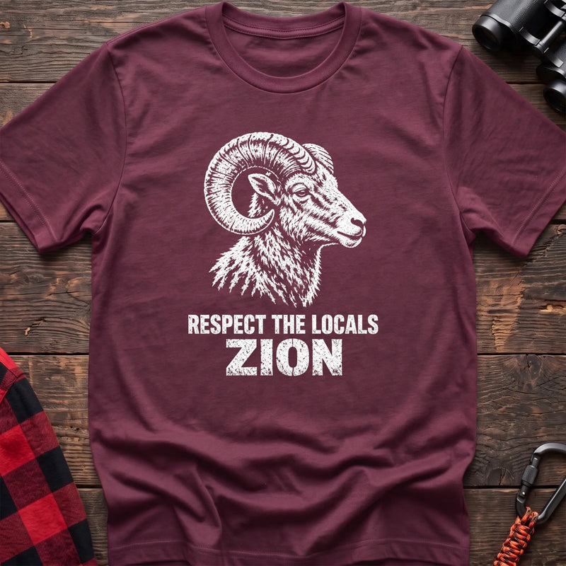 Heather maroon cotton t-shirt with a bighorn ram graphic and Respect the Locals Zion text on rustic wood