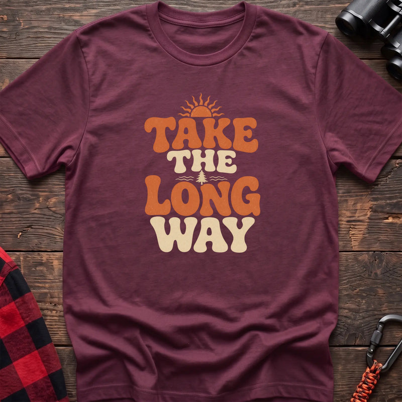 Heather maroon cotton t-shirt with retro wavy text and Take the Long Way lettering on rustic wood