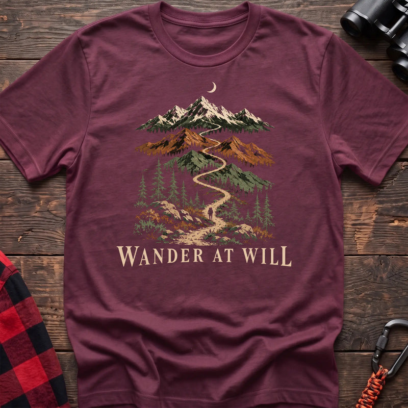 Heather maroon cotton t-shirt with a mountain trail graphic and Wander at Will text on rustic wood