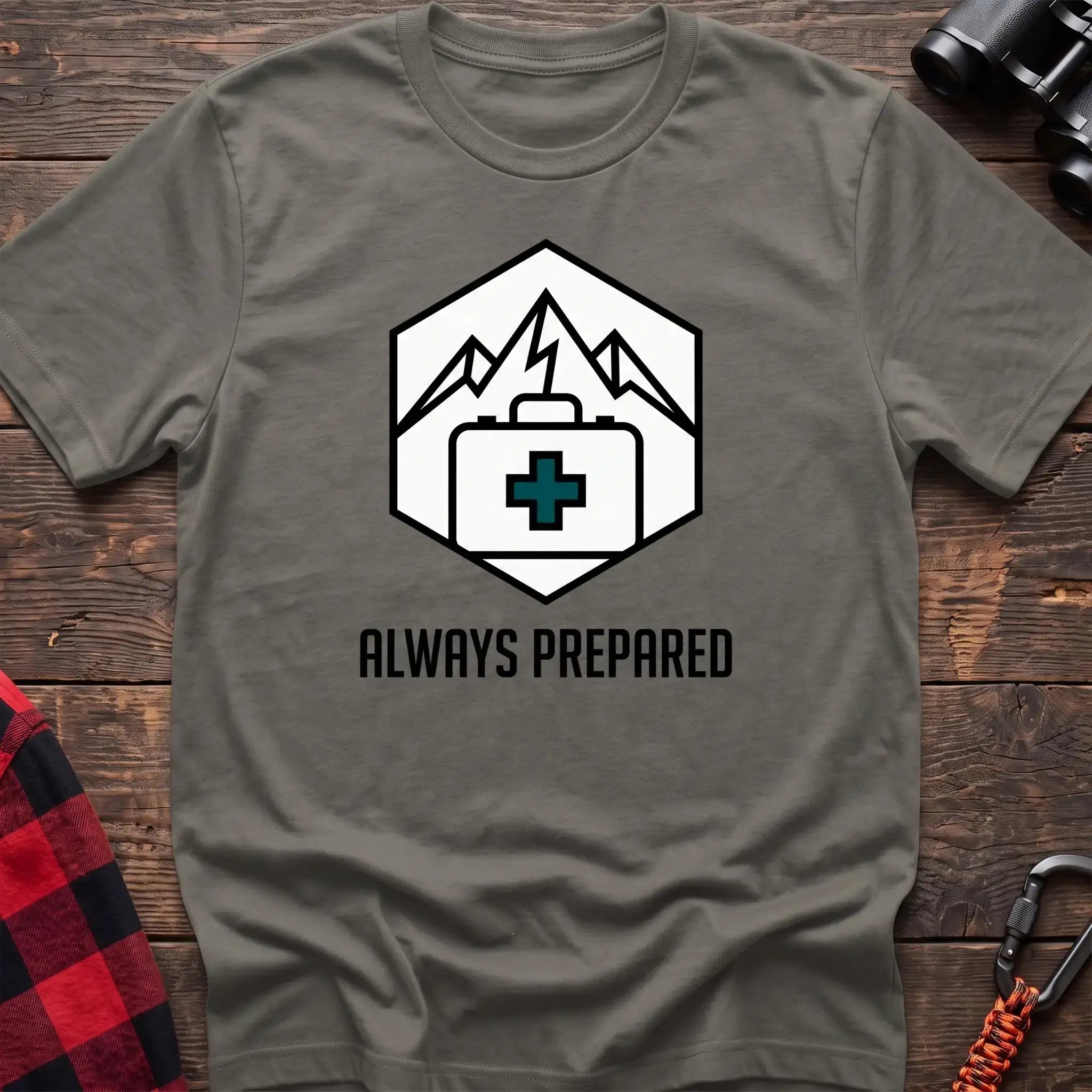 Heather military green t-shirt with hexagonal badge graphic of mountains and a first aid kit, reading Always Prepared