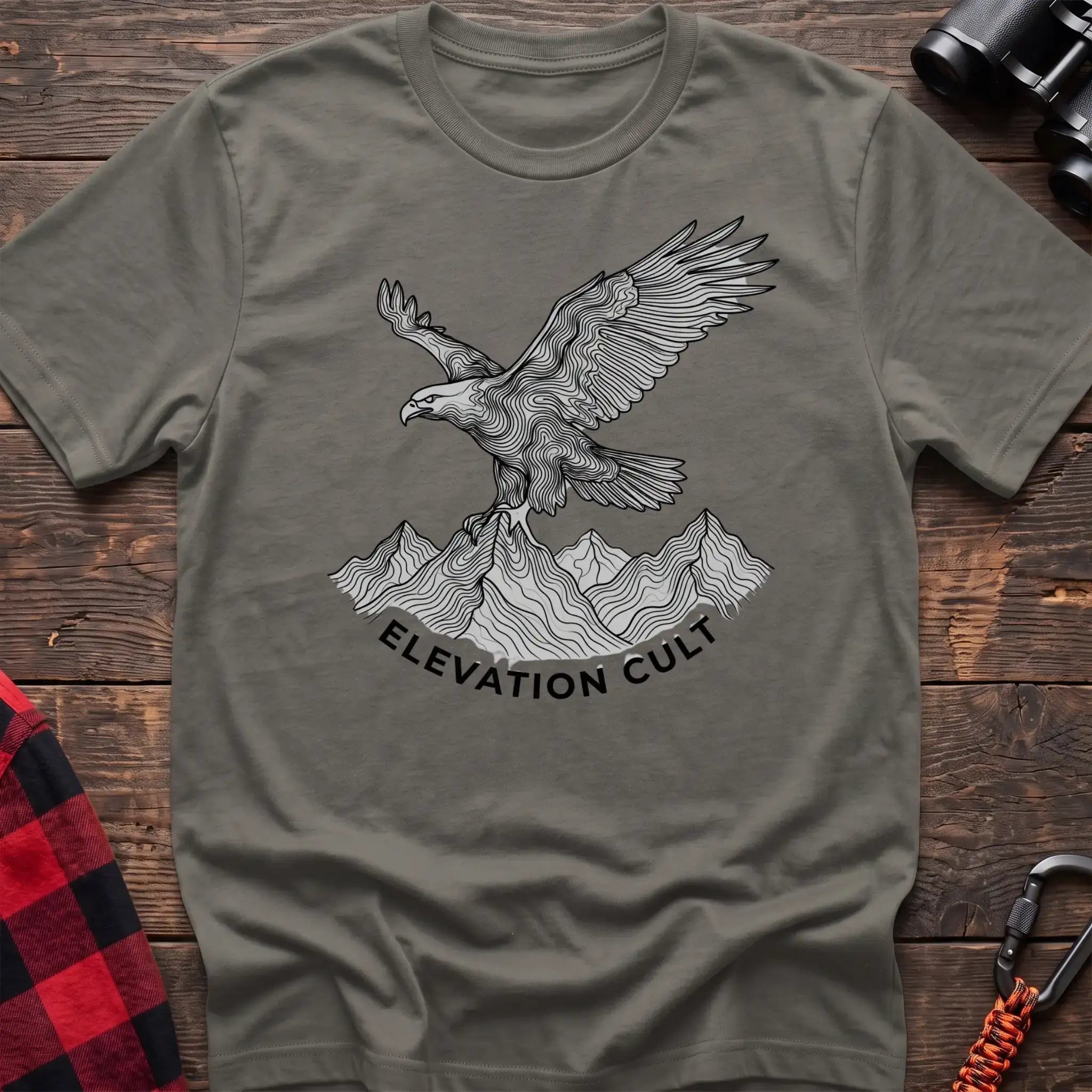 Heather military green t-shirt with detailed eagle perched on mountains graphic and the text Elevation Cult