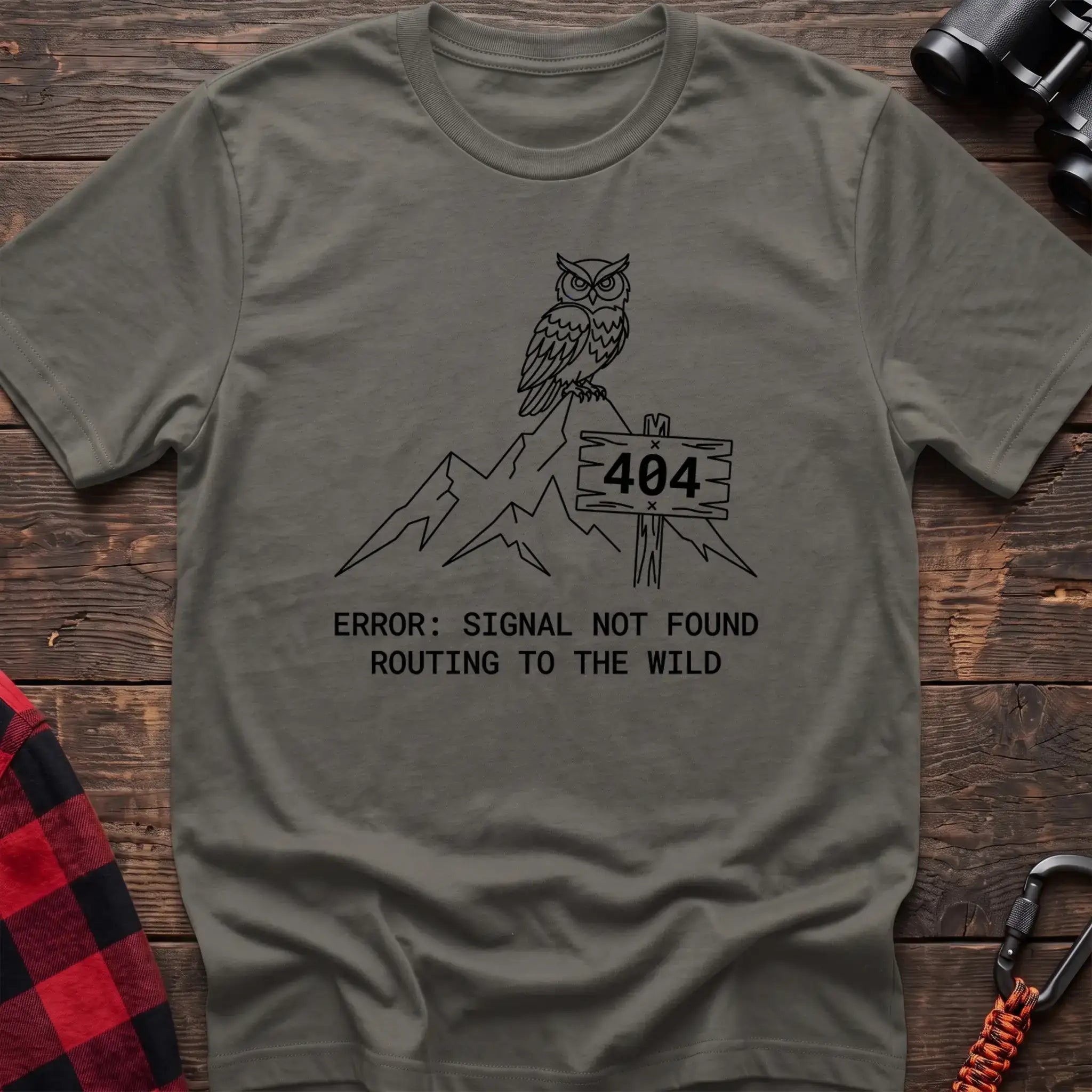 Heather military green t-shirt with owl on a mountain peak next to a 404 sign and the text Error Signal Not Found Routing to the Wild