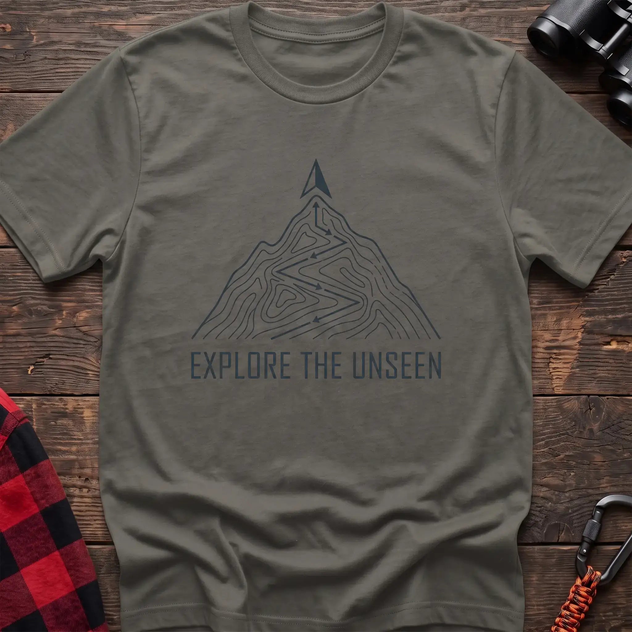 Heather military green t-shirt with topographic mountain trail graphic and the text Explore the Unseen